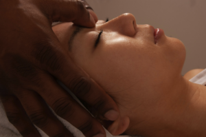 Picture of a female massage client receiving a facial at Garbo's Salon and Spa. 