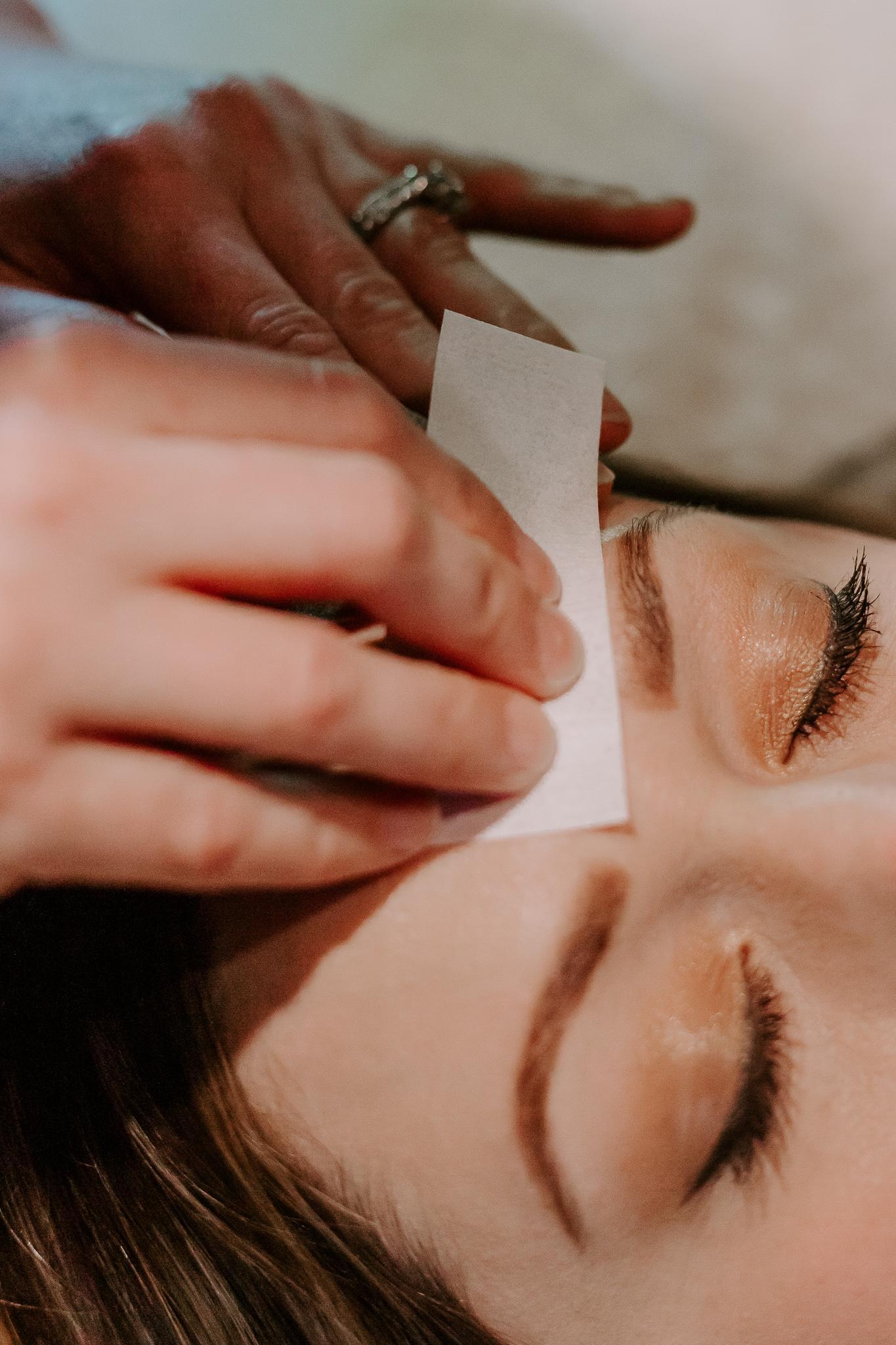 Close-up of a brow waxing and shaping treatment